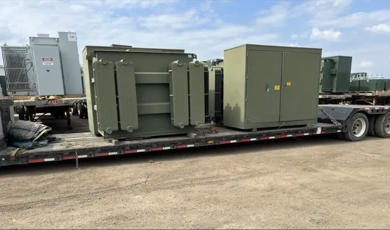 Transformers and enclosures strapped to a flatbed trailer — Fort Worth, TX