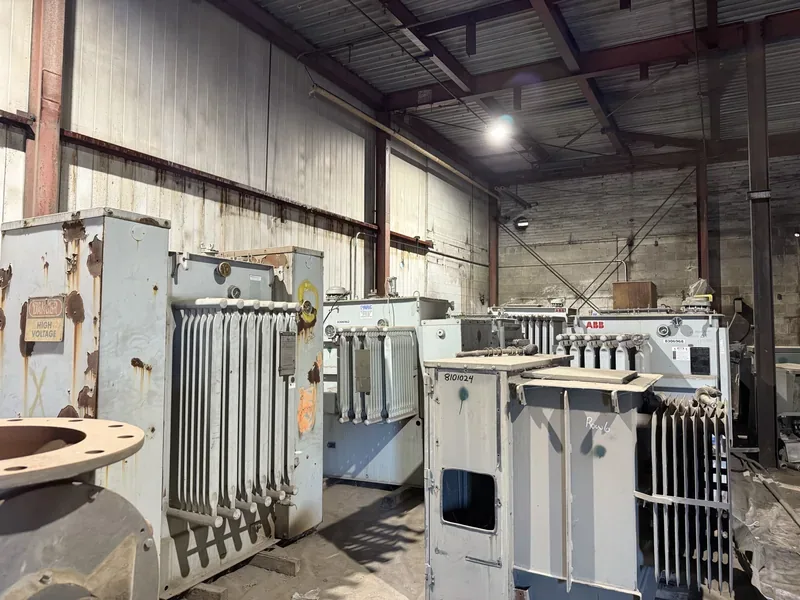 Transformers and cores staged inside a shop — Houston, TX